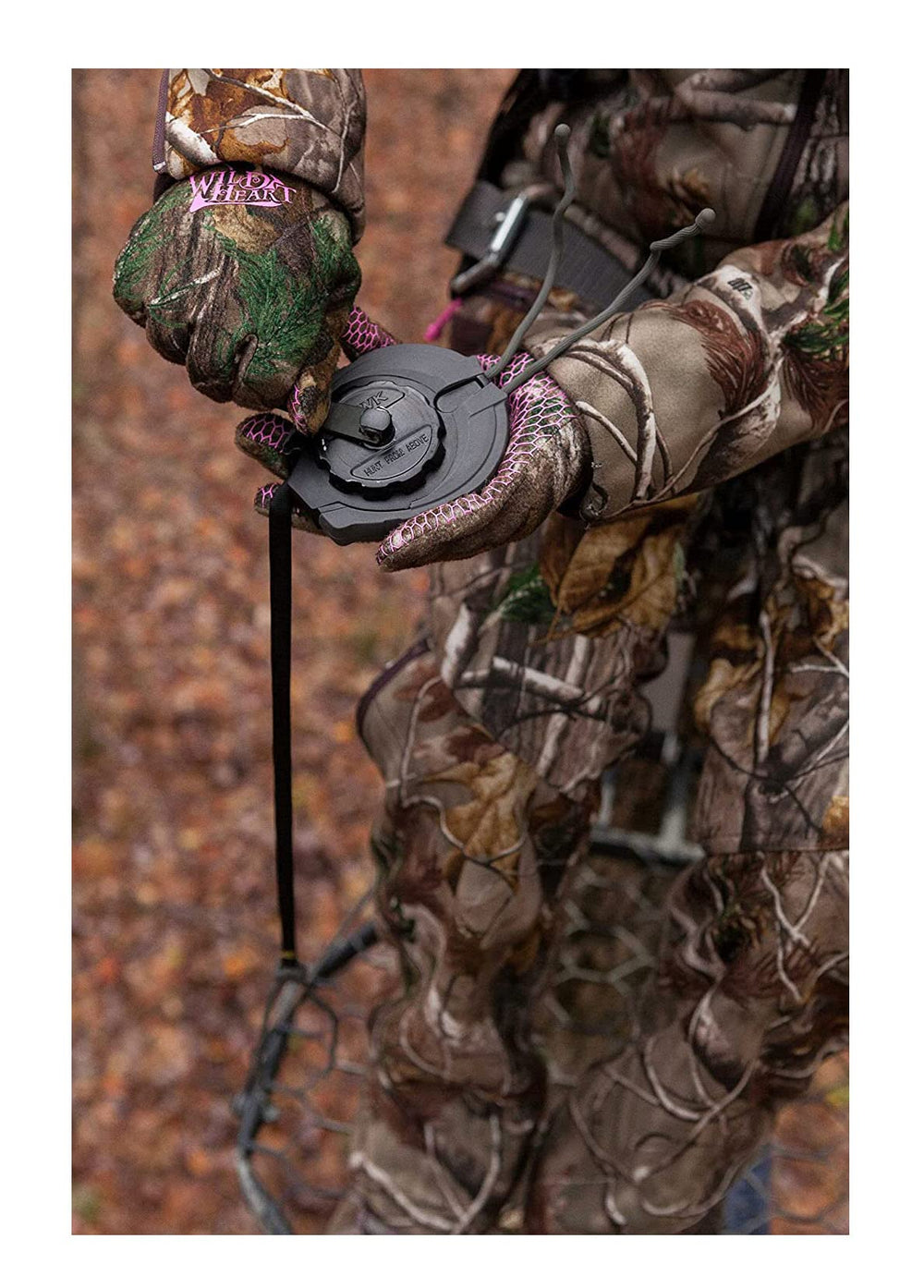 Reel attached to a belt while climbing a tree stand