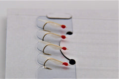 Close-up of Hayabusa Sabiki Hage hooks shows precise baiting for smaller fish.