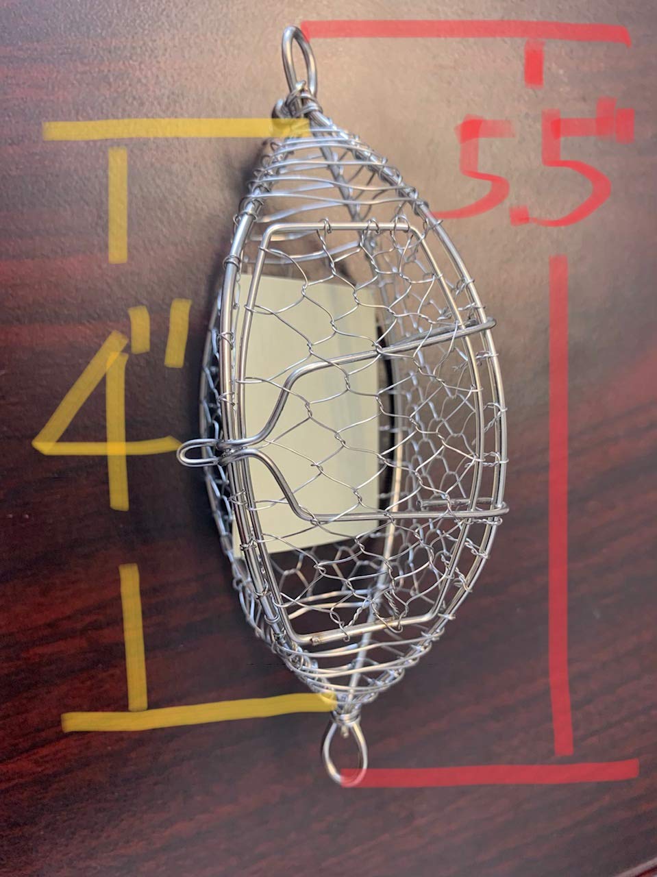 Hayabusa A-008E chum cage snap-close door keeps bait secure.