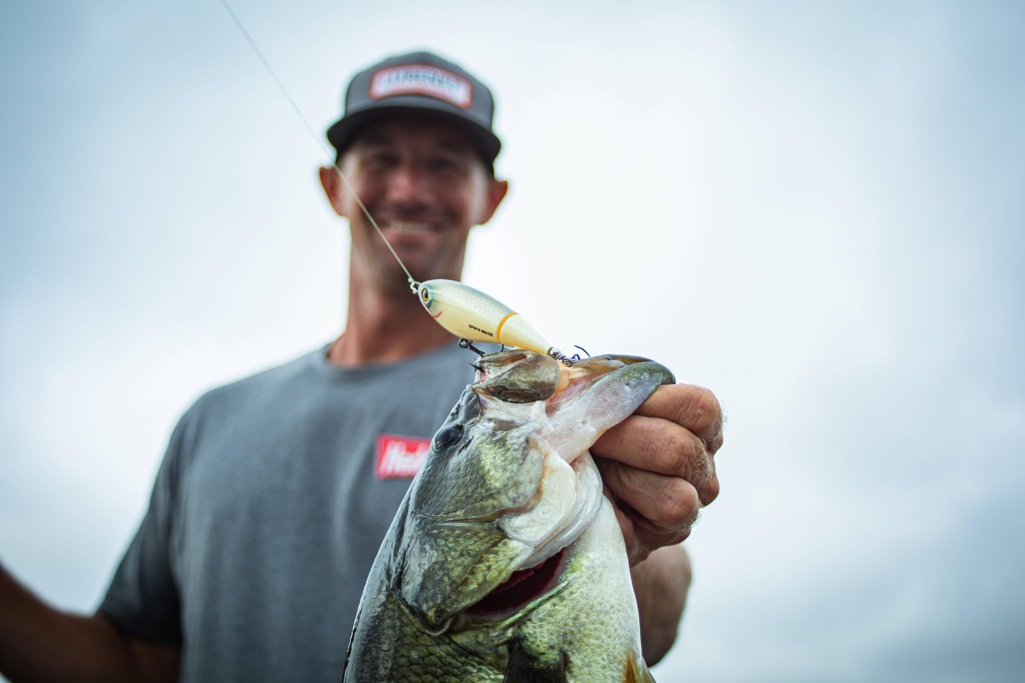 Heddon Spin'N Image bubble-trail surface action entices wary bass.