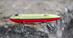 Heddon Super Spook in water action demonstrating walk-the-dog motion inviting strikes