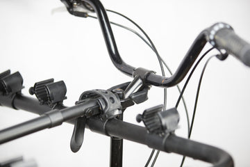 Under-seat and handlebar stems connect for stable mounting