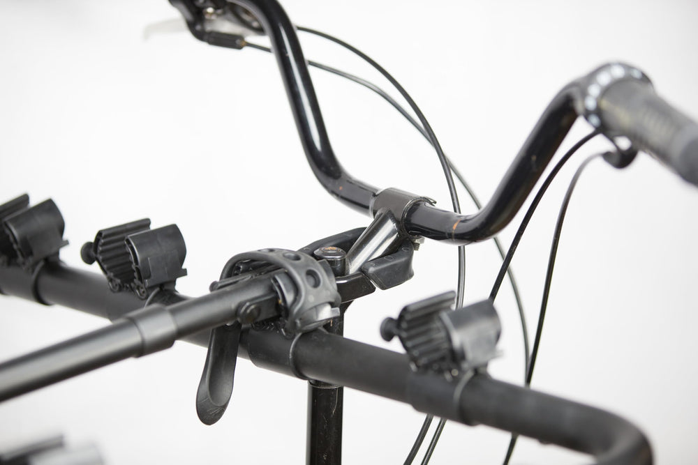 Under-seat and handlebar stems connect for stable mounting