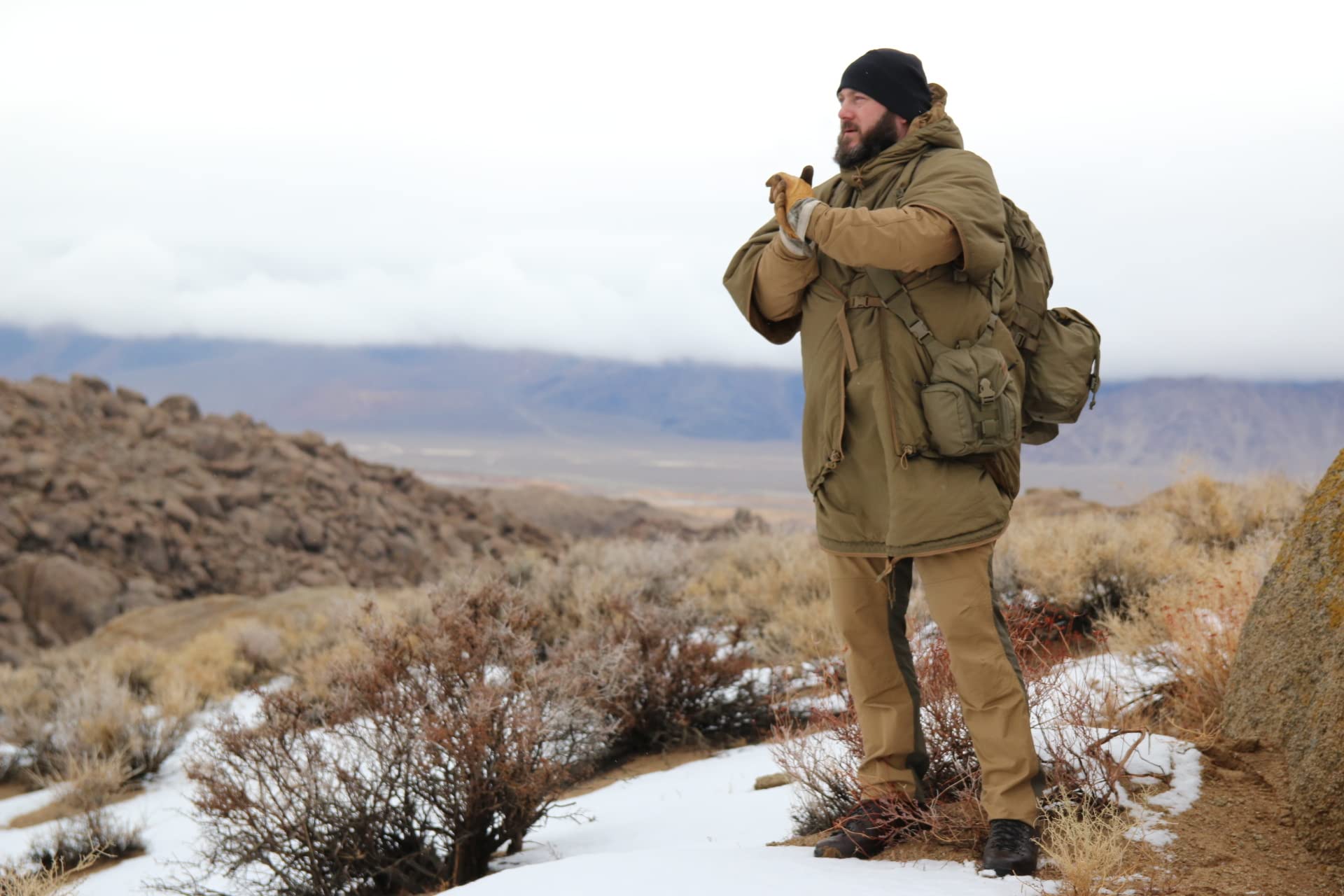 Helikon-Tex Swagman Roll emergency jacket offering rapid shelter during sudden showers.
