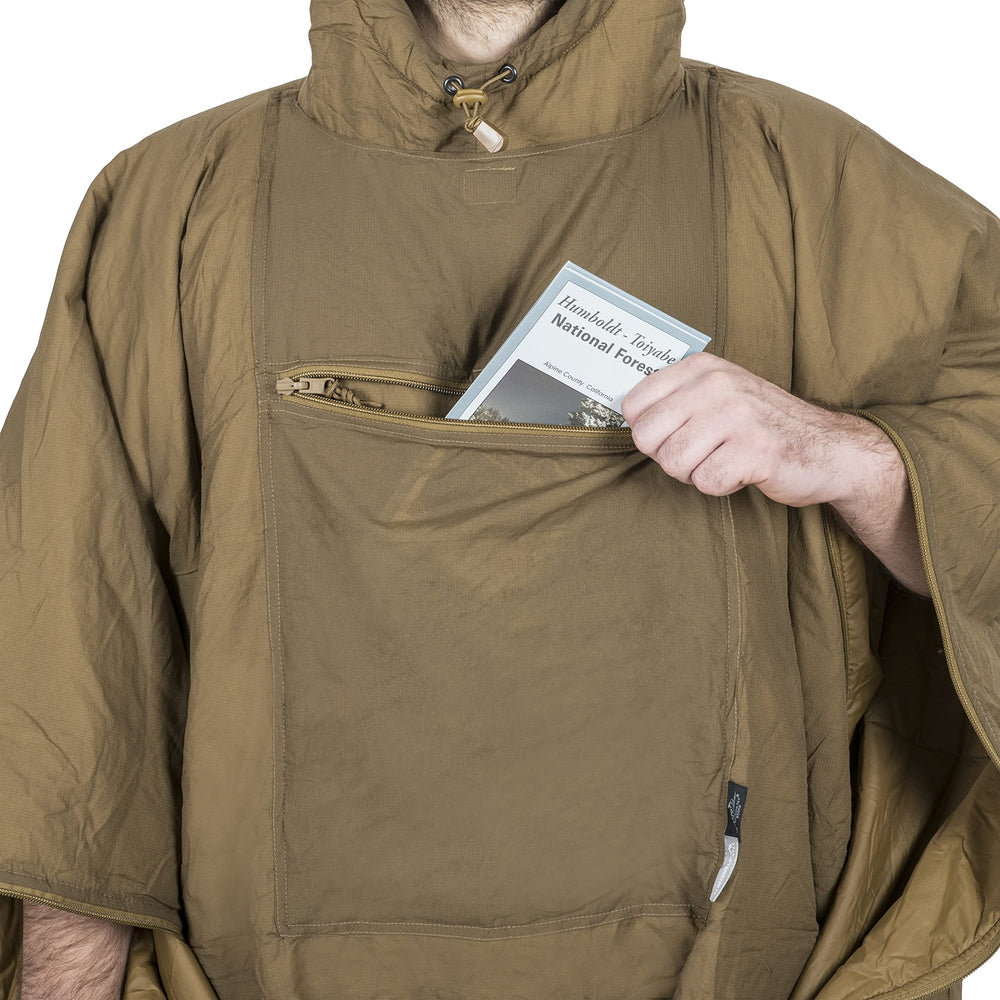 Swagman Roll poncho as hammock liner for lightweight shelter setup.