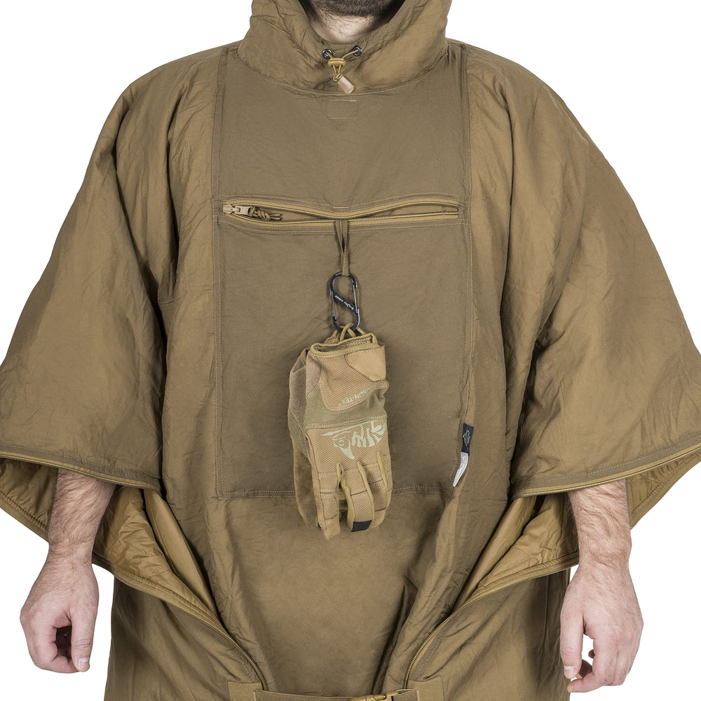 Helikon-Tex Swagman Roll poncho in use with camo pattern for versatile rain protection.