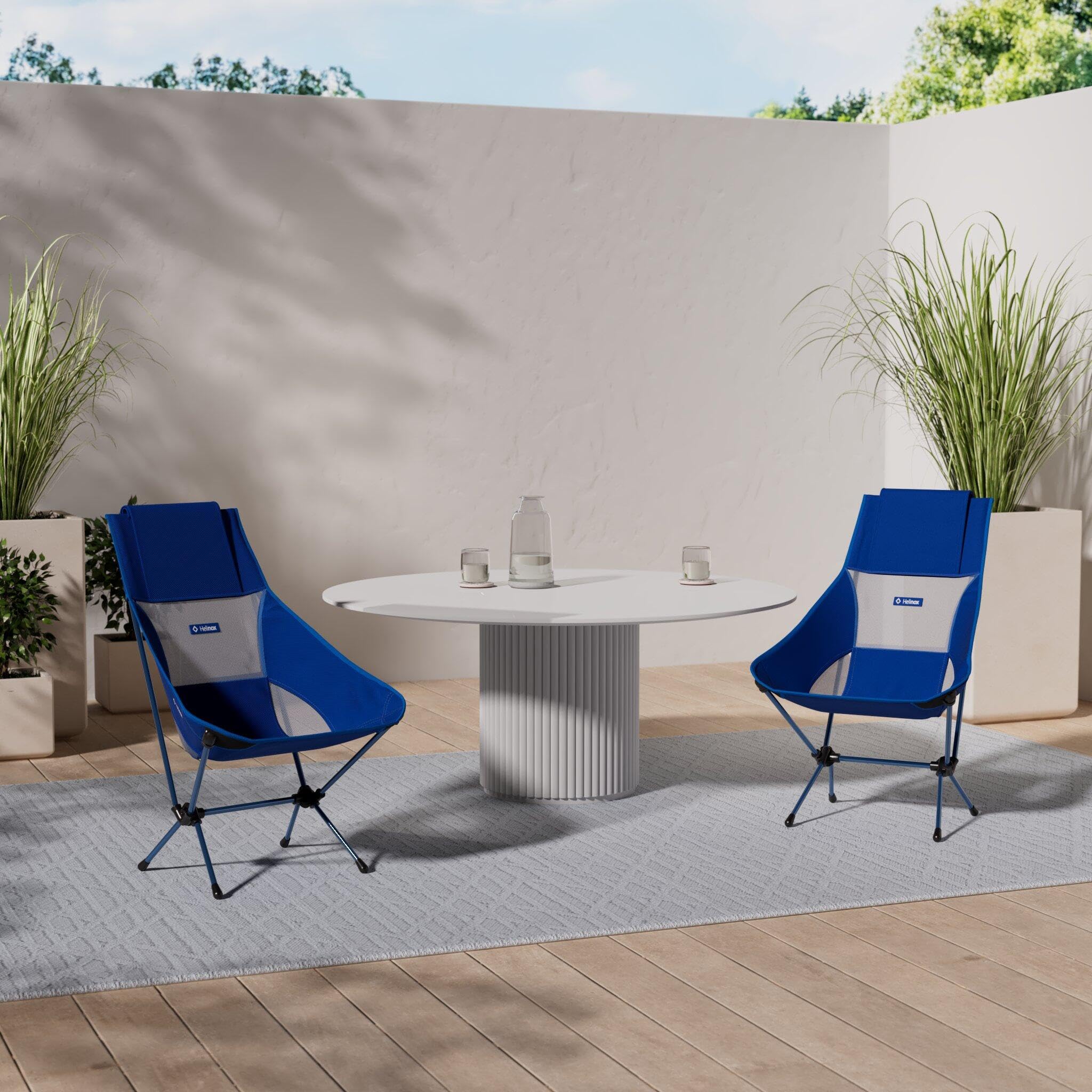 Helinox Chair Two open-back blue block showing comfortable seating outdoors.