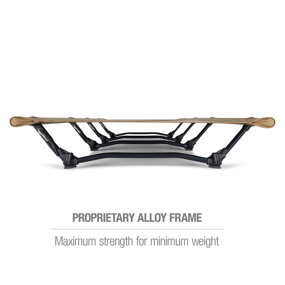 Helinox Cot Max side view in Coyote Tan emphasizes ground clearance for uneven terrain.