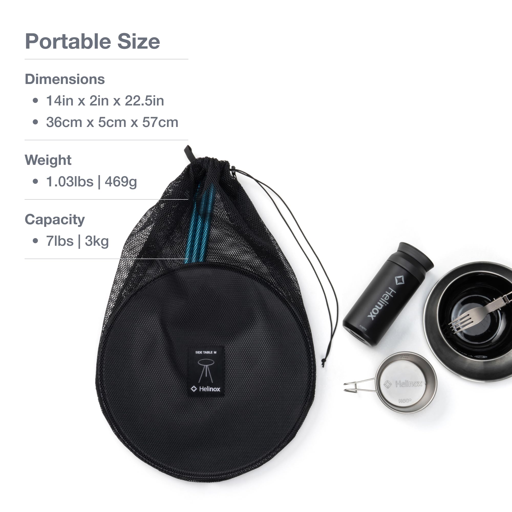 Helinox packable side table with 14-inch top in use outdoors