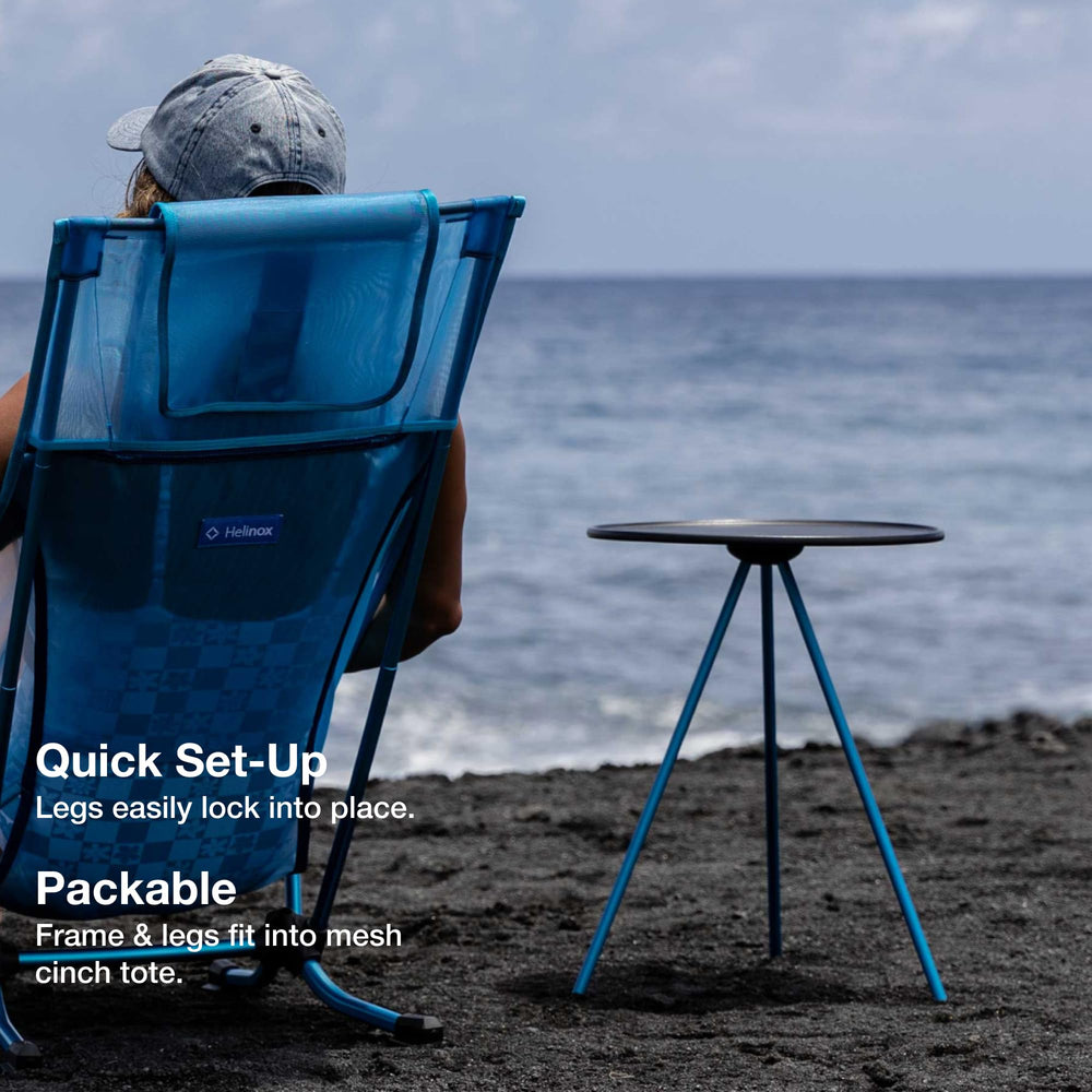 Helinox packable side table at the beach holding drinks and compact gear