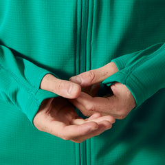 Helly-Hansen Versalite hooded fleece shows thumb holes adding warmth during chilly activities.