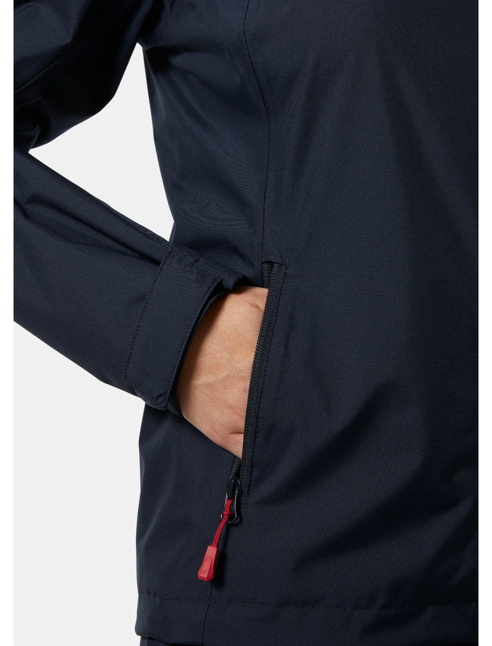 Helly-Hansen Adjustable hem drawcord for personalized fit during windy sessions.