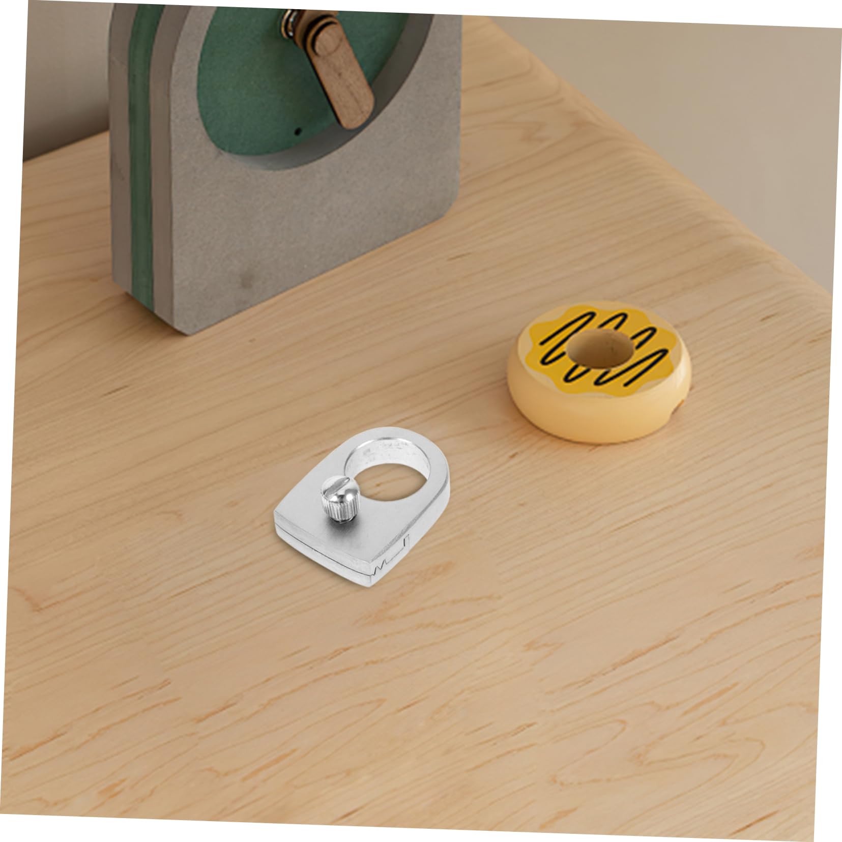Hemoton ring shown during outdoor game, compact and portable.