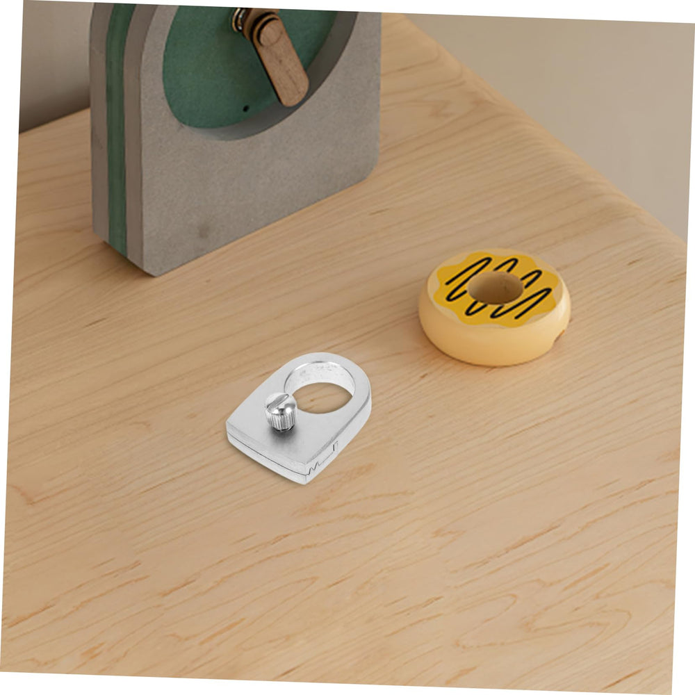 Hemoton ring shown during outdoor game, compact and portable.