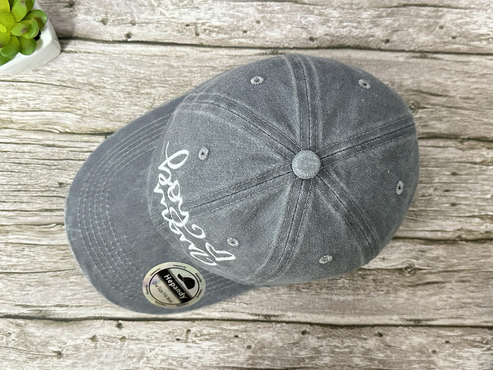 Lifestyle shot: mom wearing Washed Gray Hepandy hat