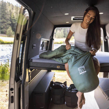 HEST packable comforter rolled for travel and compact packing.