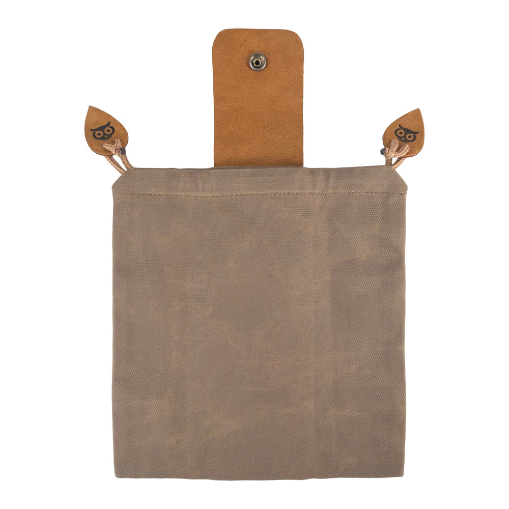 Hide & Drink waxed canvas foraging pouch opened to reveal treasures.