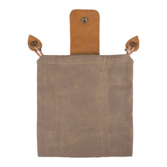 Hide & Drink waxed canvas foraging pouch opened to reveal treasures.