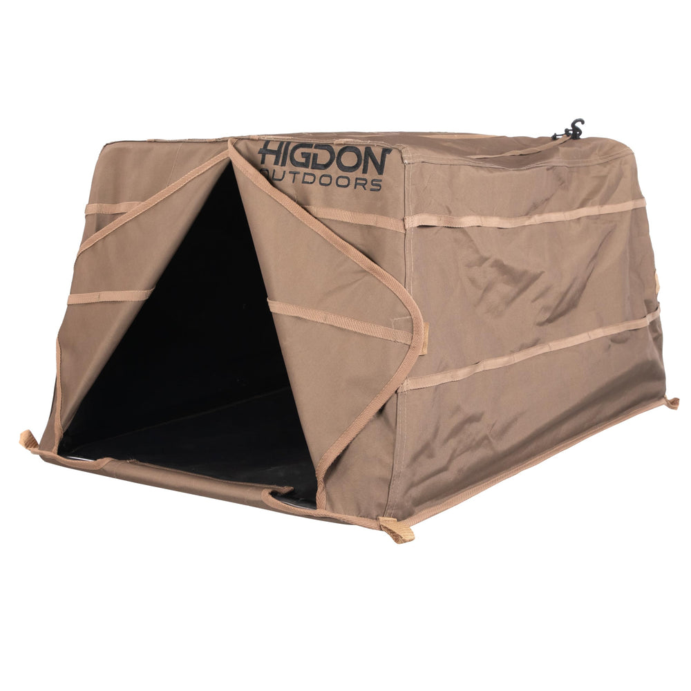 Higdon Outdoors Quick Draw Dog Blind in dirt with side entry for easy dog access.
