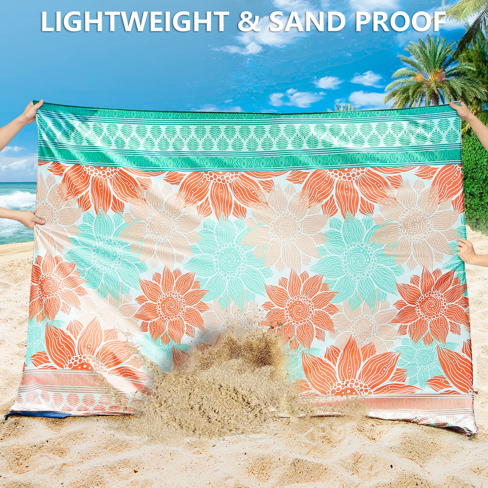 HIHOHO beach blanket anchor stakes securing the blanket on windy beach.