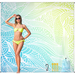 HiHOHO beach blanket laid out on sand with ripple pattern for comfy beach days.