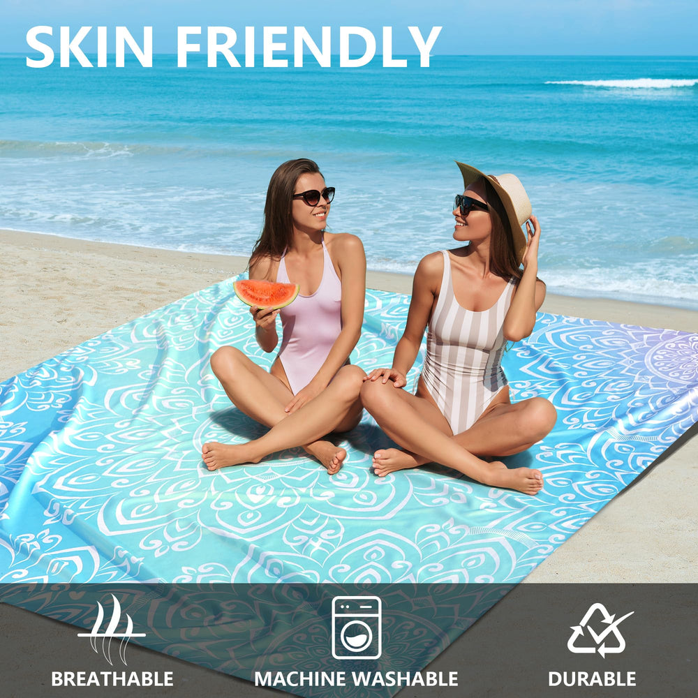 HIHOHO Beach Blanket wind-stability pockets anchored with stakes in breezy conditions.