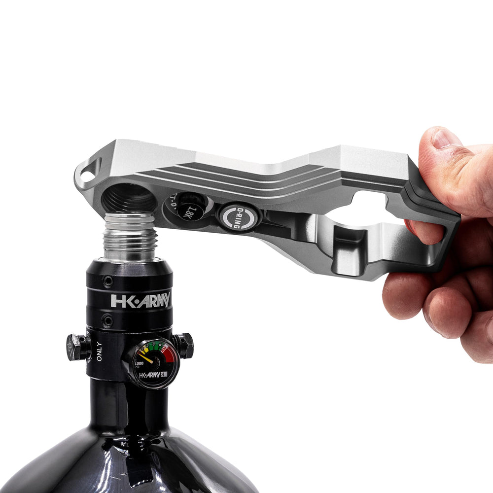 HK Army Tank Regulator Multi-Tool carabiner keeps essentials clipped to gear.