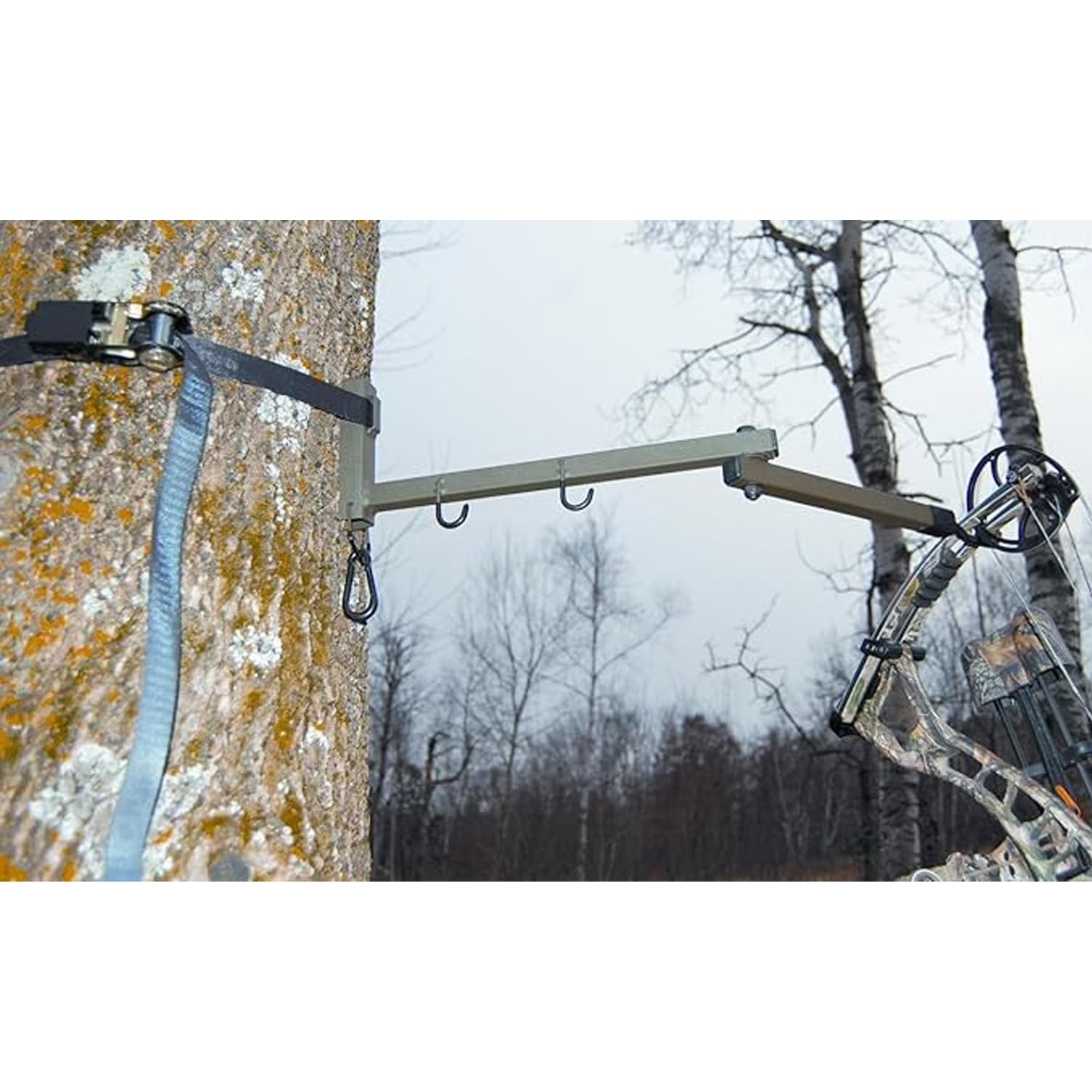 Non-invasive bow hanger that avoids tree damage in hunting locations.