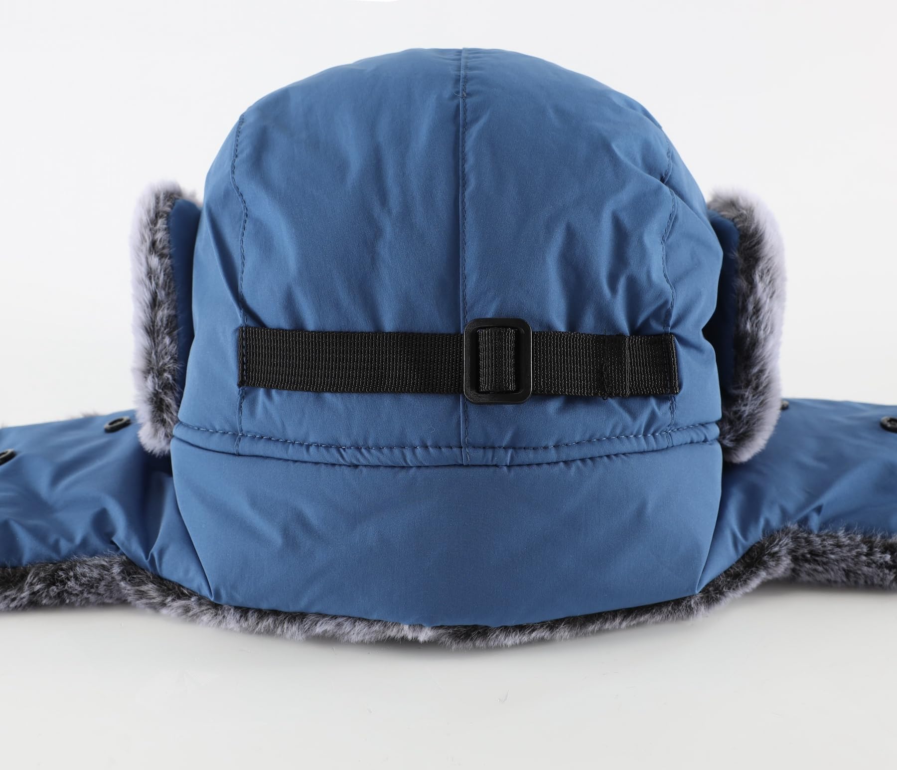 Home Prefer trapper hat blue color worn in winter outdoor settings.