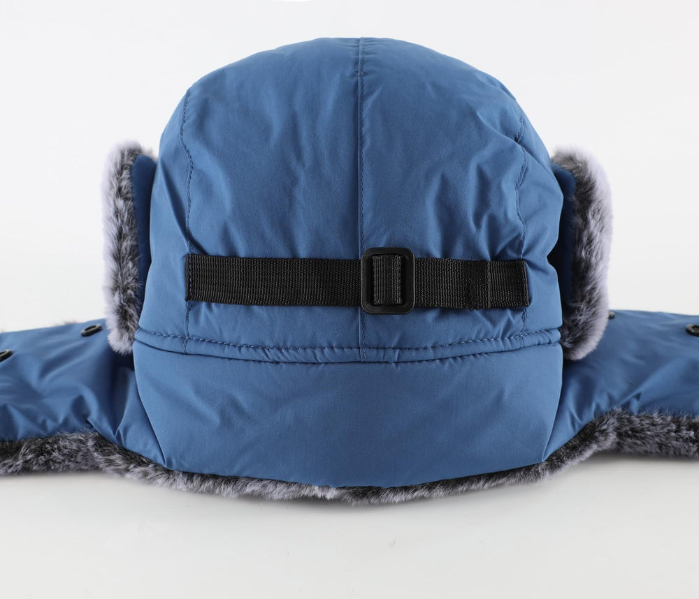 Home Prefer trapper hat blue color worn in winter outdoor settings.