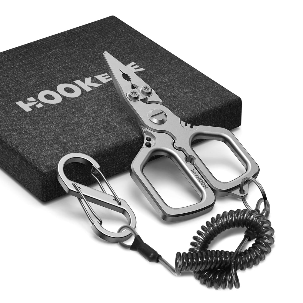 Titanium fishing pliers showing split-ring removal capability