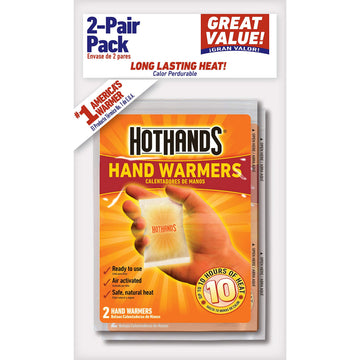 HotHands hand warmers held inside a glove delivering safe, natural warmth during cold outdoor activities