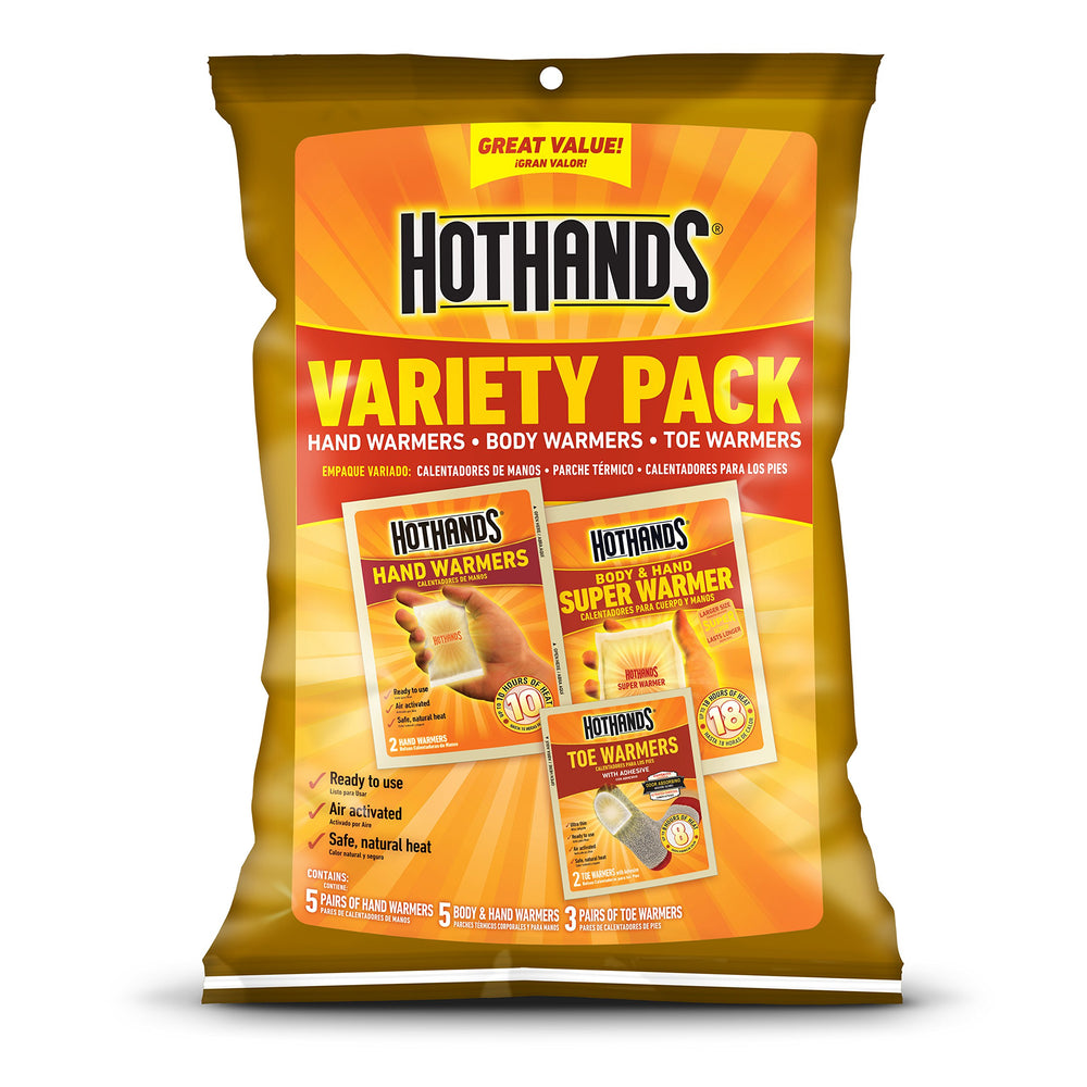 HotHands hand warmers being activated for outdoor warmth.