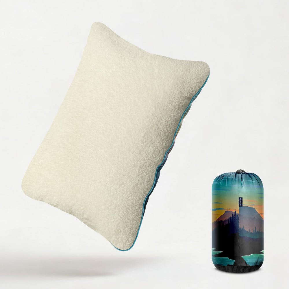 Hotkoko camping pillow with waterproof coating resists dust and sand outdoors.