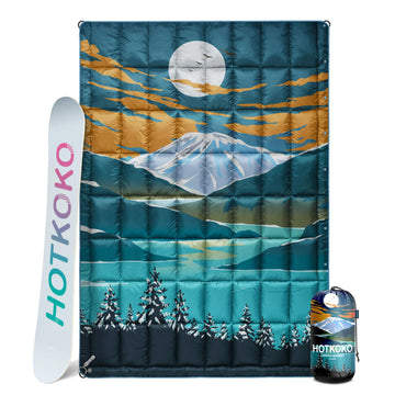 Hotkoko down camping blanket folded compactly for travel and storage.