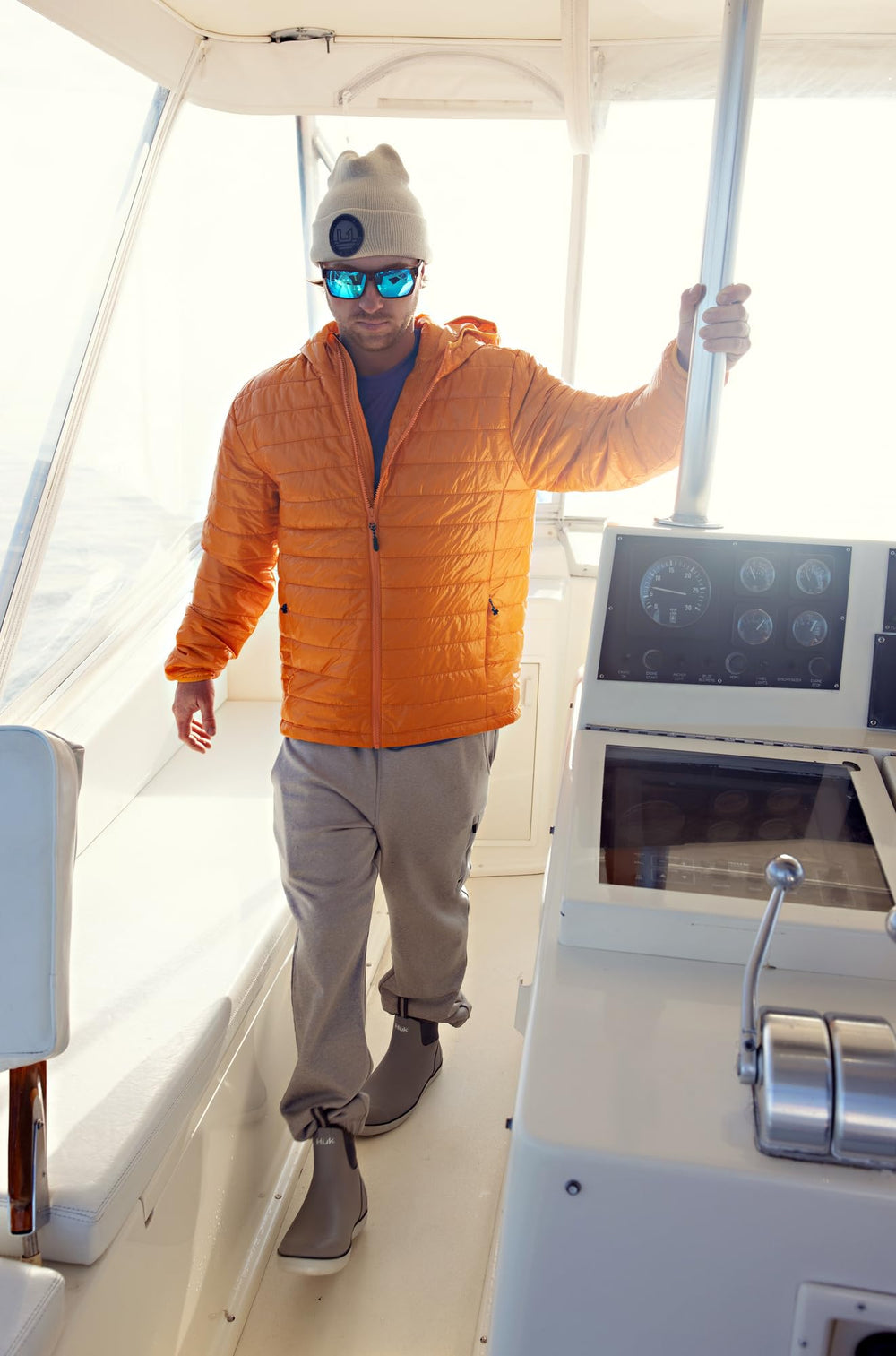 HUK embossed beanie packed in bag shows travel-friendly warmth