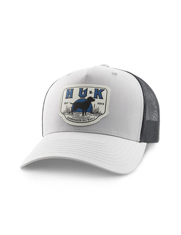 HUK Kids Trucker Hat in Harbor Mist with lab patch, ideal for outdoor adventures.