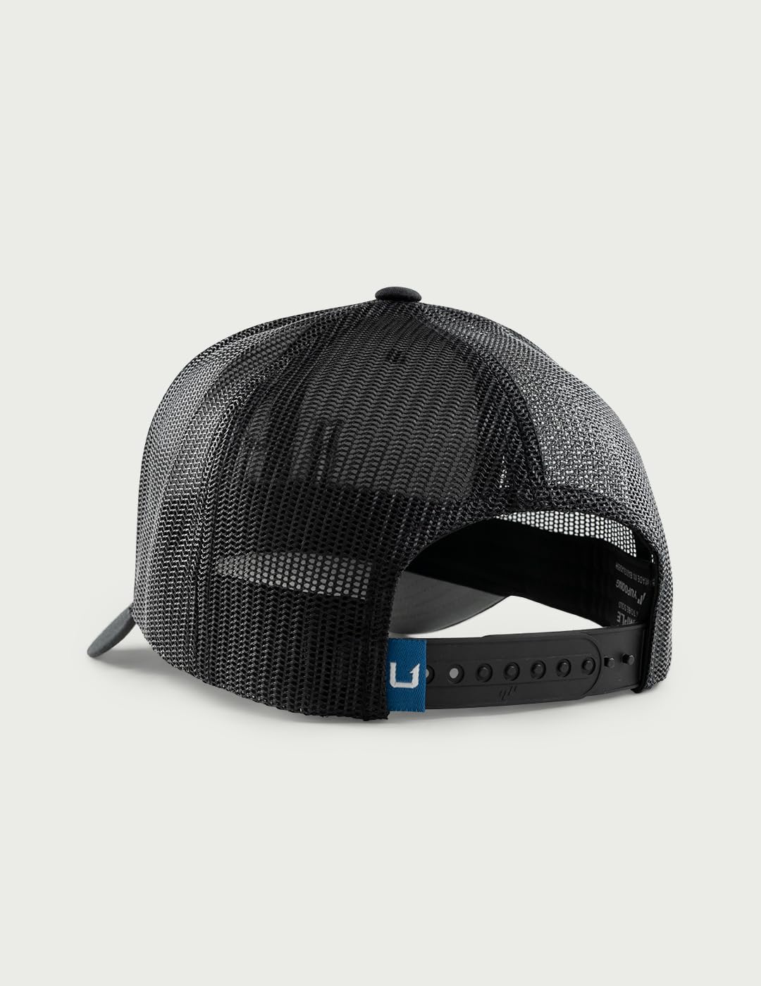 HUK men's trucker hat side profile with adjustable snapback for secure all-day wear.