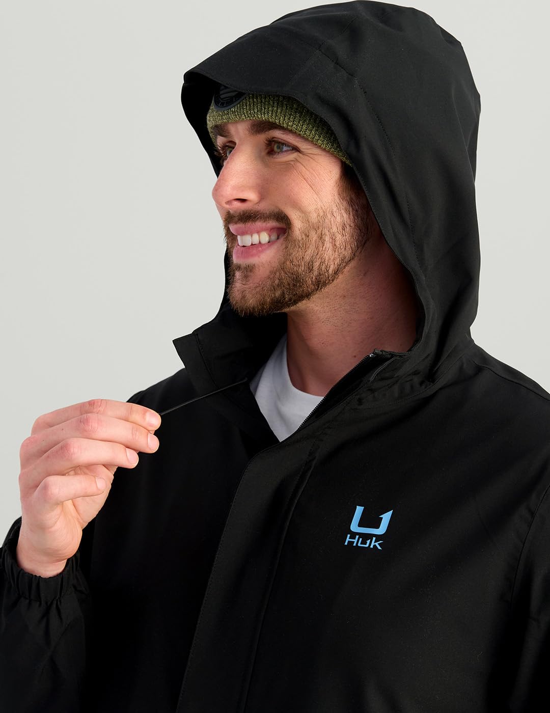 HUK Storm Rain Jacket 2.0 covered pockets protect essentials from rain.