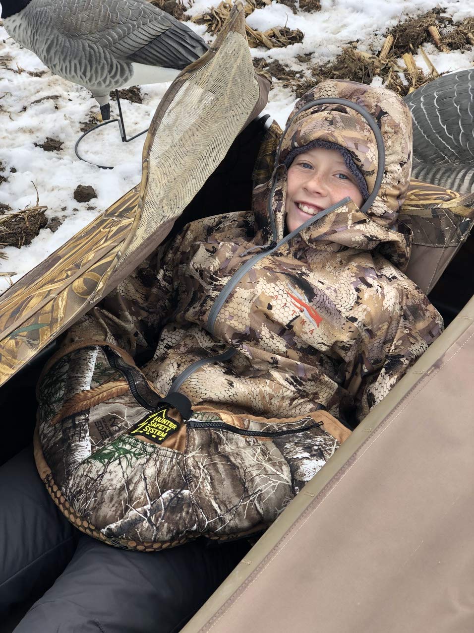 Hunter Safety System Muff Pak worn setup demonstrates hands-free accessibility and quiet hunting comfort