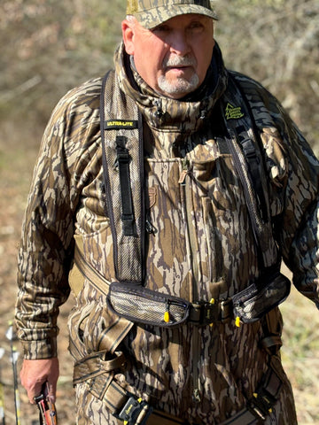 Hunter Safety System Ultra-Lite 4X/5X harness in use on tree with climbing gear for safer ascent