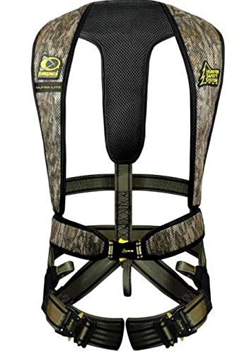 Hunter Safety System Ultra-Lite harness Mossy Oak Bottomland in-use for deer hunting with secure straps.
