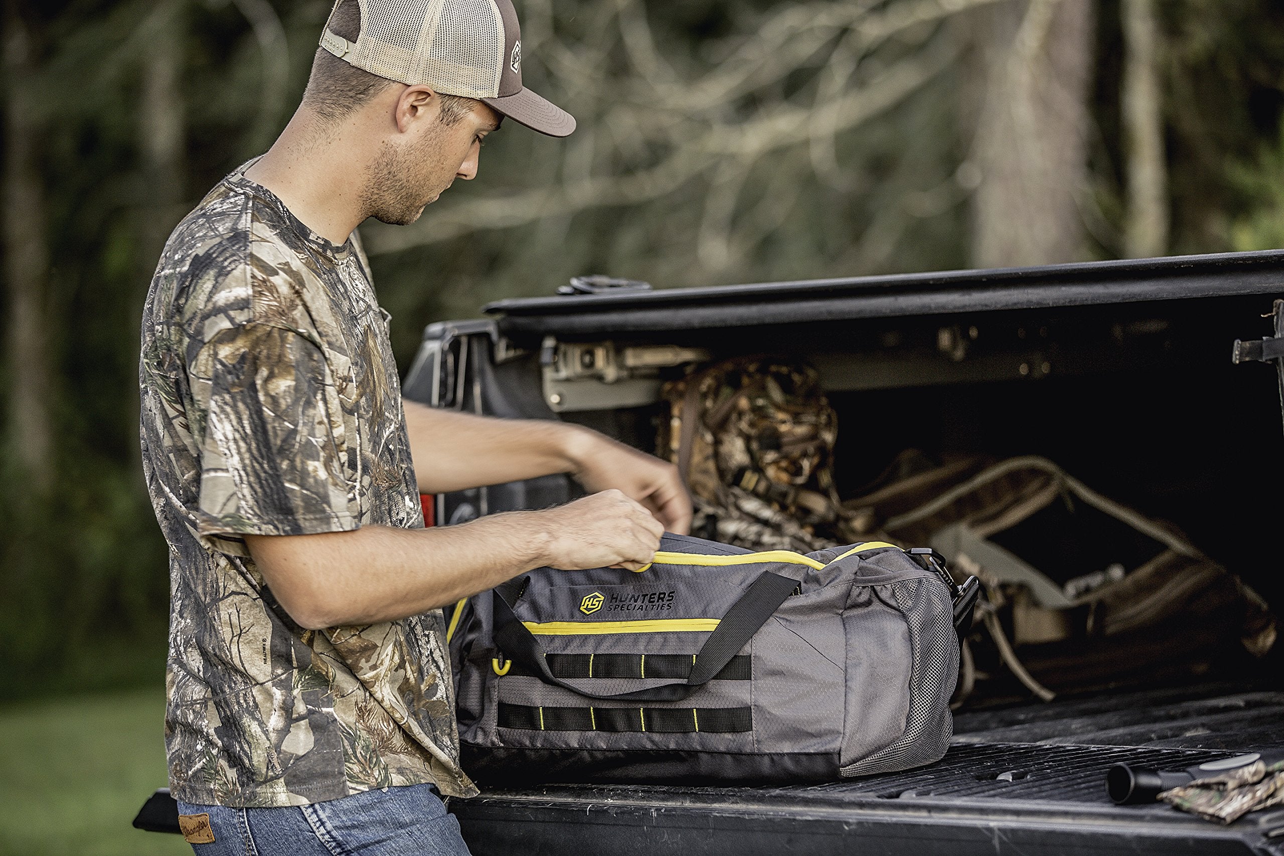 Exterior MOLLE straps for attaching extra gear and accessories on the duffel.