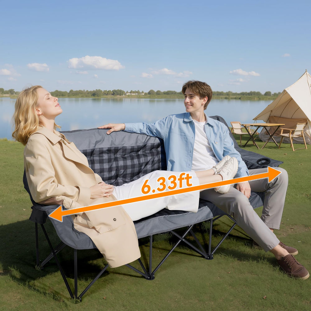 Huskfirm camping chair on grass or sand demonstrates stability with non-slip foot pads.