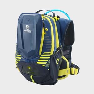 Husqvarna Dakar hydration backpack side pouch showing expandable pocket for helmet or gear