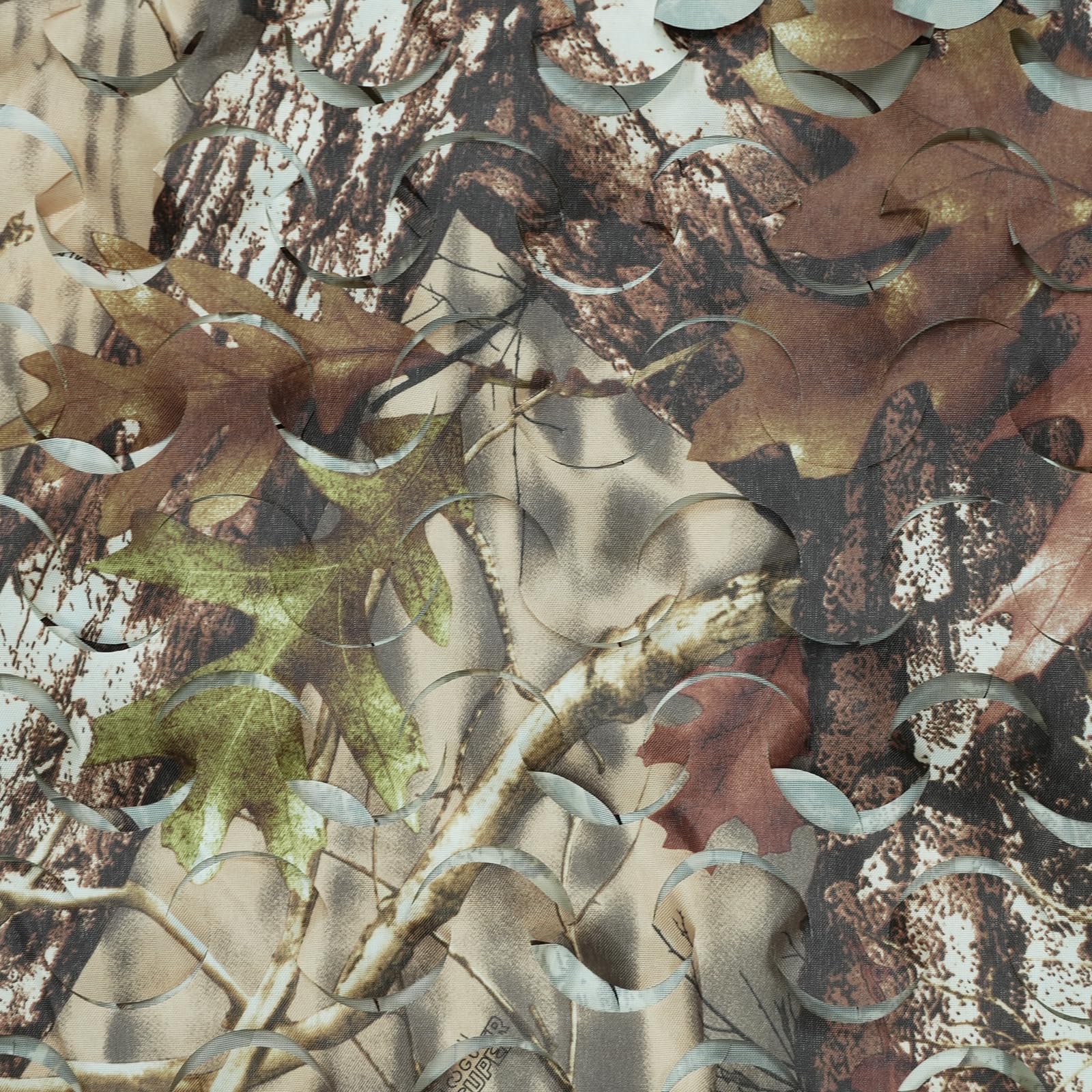 HYOUT camo netting being cut to size demonstrates easy customization.