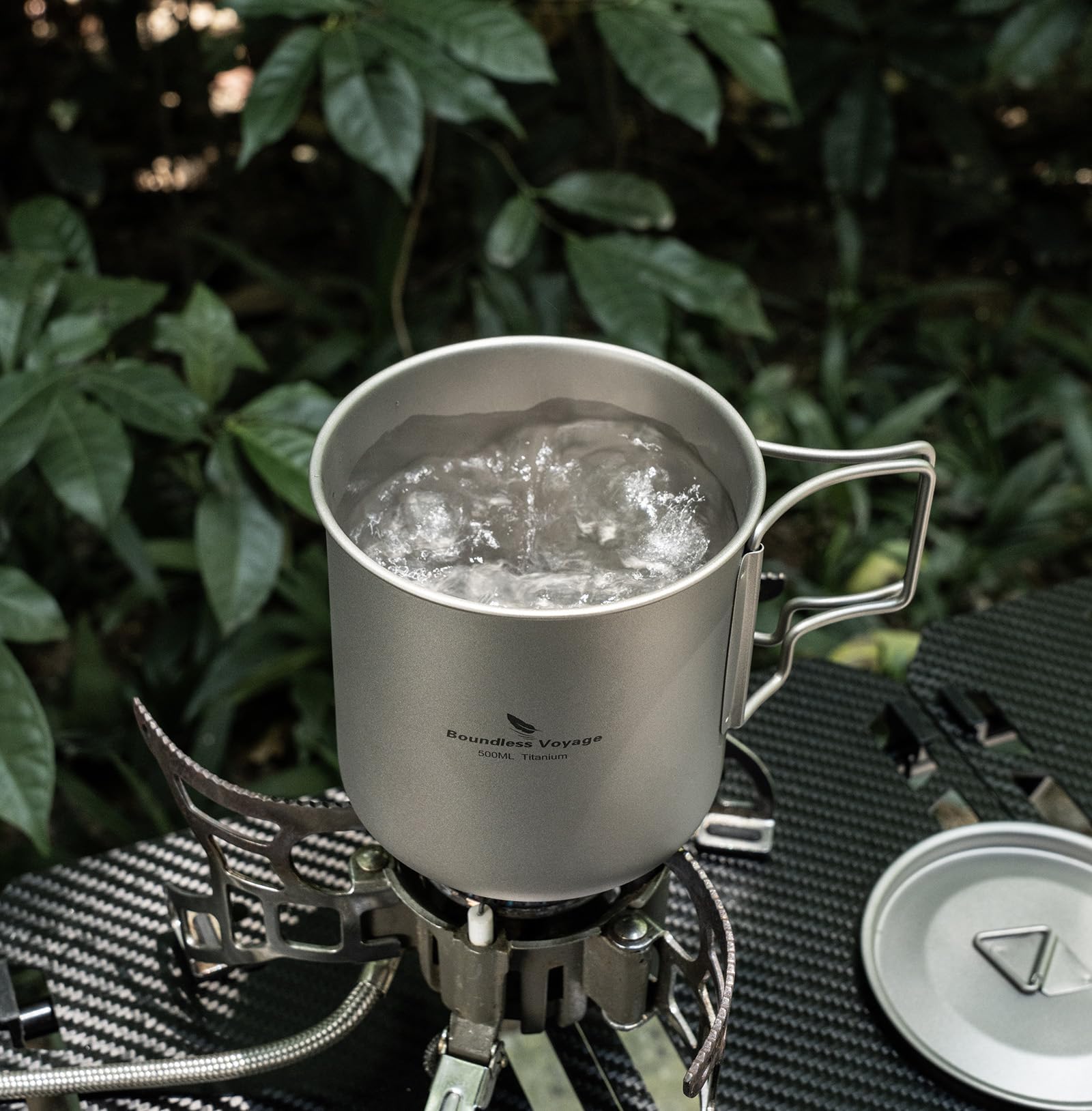 Compact-storage-friendly titanium mug by iBasingo for small packs.