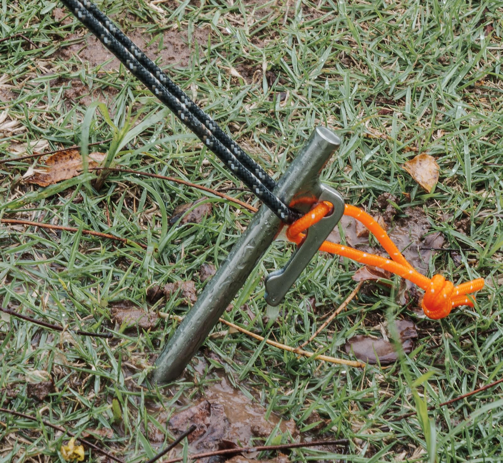 iBasingo titanium stake in use anchoring a tent on rocky coast