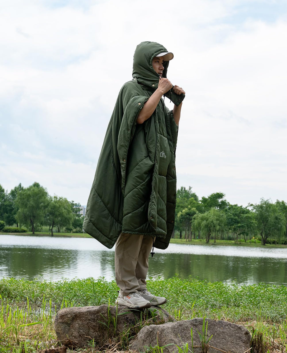 iClimb hooded poncho worn in green showing full-body warmth with hands free