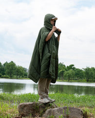 iClimb hooded poncho worn in green showing full-body warmth with hands free